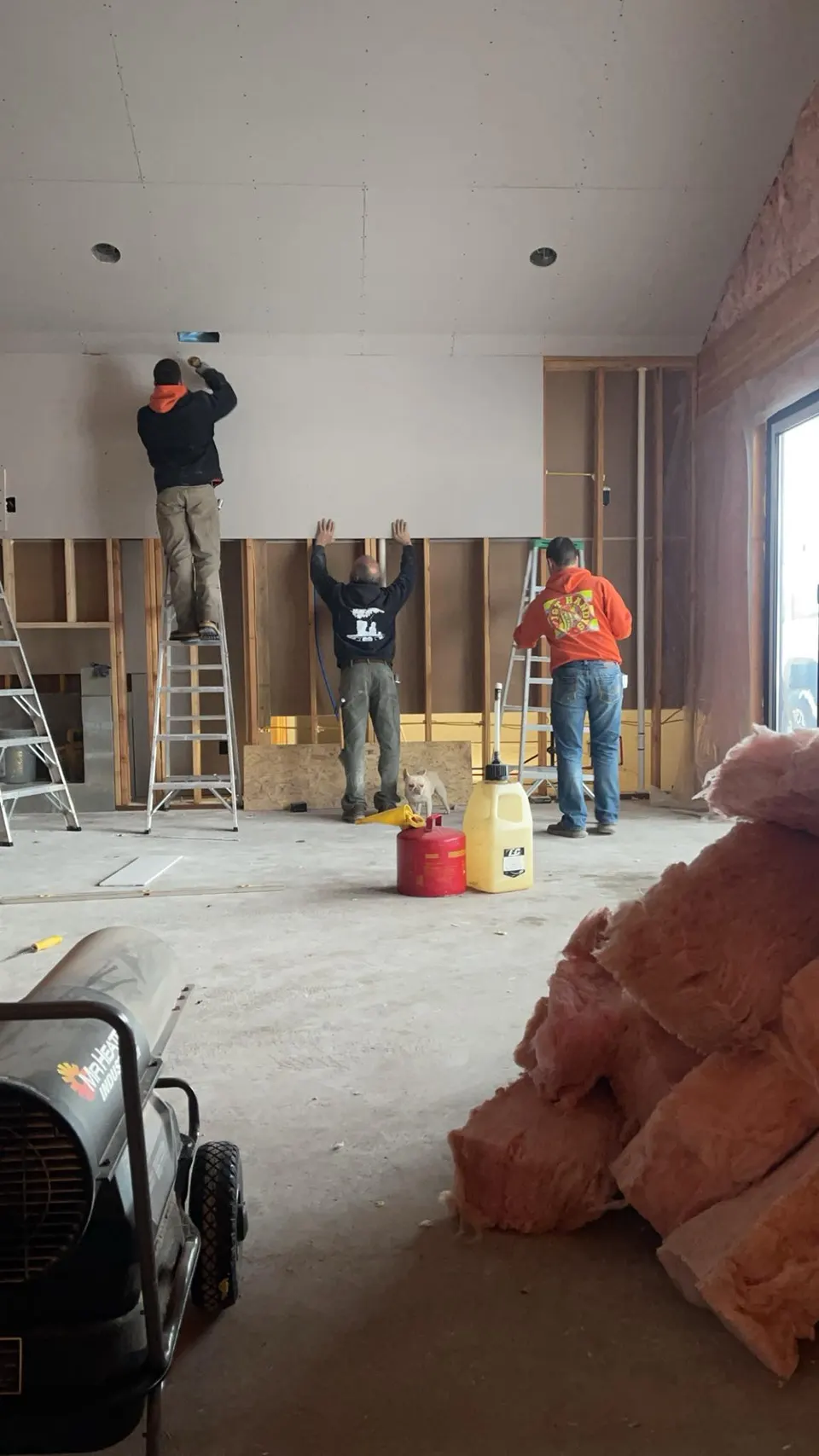 Handy's Construction crew installing drywall in a Missoula, MT remodel